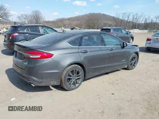 2018 Ford Fusion SE z VIN 3FA6P0LU6JR118226, wystawiony jako IAAI lot #41811406 z przebiegiem 165 352 mil mil oraz . Historia ofert i sprzedaży dostępna na DreamBid. Obrazek 4.