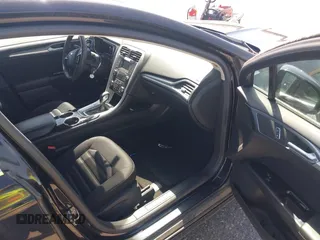 2013 Ford Fusion SE Hybrid with VIN 3FA6P0LUXDR298606, listed as a IAAI auction lot 41976525 with 121,660 mi miles. Bid and sale history available at carsss.com. Image 5.