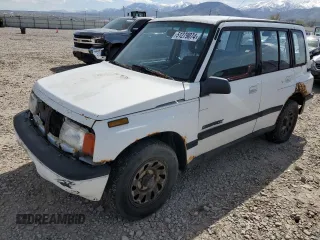 1995 Suzuki Sidekick z VIN JS3TD03V4S4113472, wystawiony jako Copart lot #51279074 z przebiegiem 199 736 mil mil oraz Tytuł czysty. Historia ofert i sprzedaży dostępna na DreamBid. Obrazek 1.
