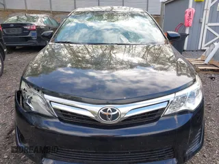 2014 Toyota Camry L with VIN 4T4BF1FK7ER395057, listed as a IAAI auction lot 42215441 with 166,247 mi miles and . Bid and sale history available at DreamBid. Image 13.