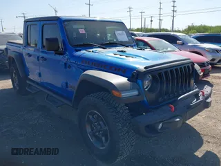 2023 Jeep Gladiator Rubicon z VIN 1C6JJTBG3PL581023, wystawiony jako IAAI lot #41963931 z przebiegiem 15 023 mil mil oraz . Historia ofert i sprzedaży dostępna na DreamBid. Obrazek 1.