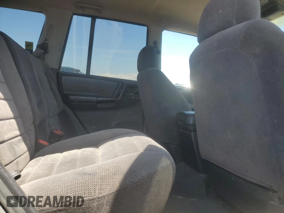1997 Jeep Grand Cherokee Laredo z VIN 1J4GZ58S6VC636803, wystawiony jako Copart lot #59977115 z przebiegiem Nie podano mil oraz Szkoda całkowita • Salvage title. Historia ofert i sprzedaży dostępna na DreamBid. Obrazek 11.