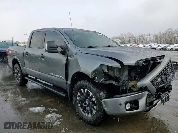 2018 Nissan Titan Pro-4X z VIN 1N6AA1E51JN536680, wystawiony jako Copart lot #82361724 z przebiegiem 98 699 mil mil oraz Szkoda całkowita • Salvage title. Historia ofert i sprzedaży dostępna na DreamBid. Obrazek 13.