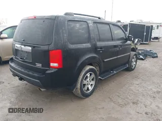 2011 Honda Pilot Touring with VIN 5FNYF4H94BB089930, listed as a IAAI auction lot 41477596 with 171,831 mi miles. Bid and sale history available at carsss.com. Image 4.