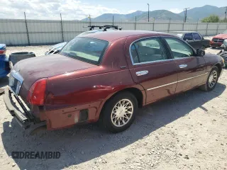 2000 Lincoln Town Car Signature with VIN 1LNHM82W2YY809189, listed as a Copart auction lot 59812665 with 148,236 mi miles and Salvage title. Bid and sale history available at DreamBid. Image 3.