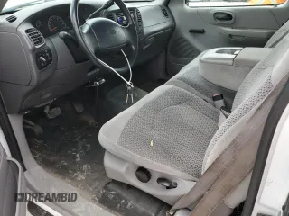 1999 Ford F-150 with VIN 2FTRX17W3XCA68816, listed as a Copart auction lot 53080755 with 201,501 mi miles and Salvage Title. Bid and sale history available at DreamBid. Image 8.