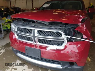 2013 Dodge Durango SXT with VIN 1C4RDJAG4DC527945, listed as a IAAI auction lot 41590545 with 141,074 mi miles and . Bid and sale history available at DreamBid. Image 6.