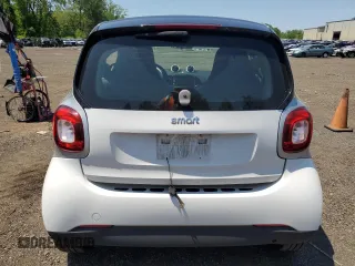 2016 Smart fortwo Passion z VIN WMEFJ5DA5GK123218, wystawiony jako Copart lot #58978095 z przebiegiem 73 608 mil mil oraz Szkody całkowita. Historia ofert i sprzedaży dostępna na DreamBid. Obrazek 6.