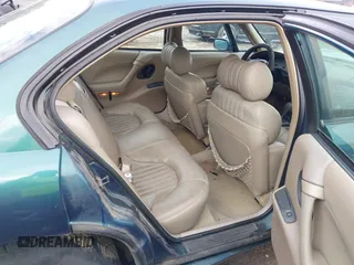 1996 Pontiac Bonneville z VIN 1G2HZ5210TH210829, wystawiony jako IAAI lot #41203888 z przebiegiem 154 990 mil mil oraz . Historia ofert i sprzedaży dostępna na DreamBid. Obrazek 8.