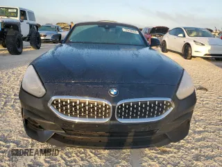 2020 BMW Z4 sDrive30i with VIN WBAHF3C03LWW64905, listed as a Copart auction lot 77010554 with 27,612 mi miles and Salvage Title. Bid and sale history available at carsss.com. Image 5.