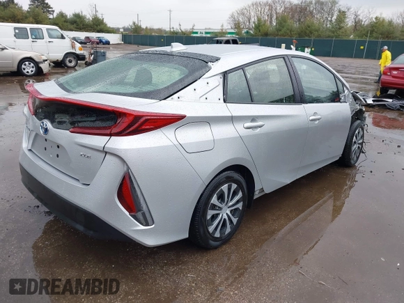 2021 Toyota Prius LE with VIN JTDKAMFP9M3170928, listed as a IAAI auction lot 42123934 with 58,293 mi miles and . Bid and sale history available at DreamBid. Image 4.