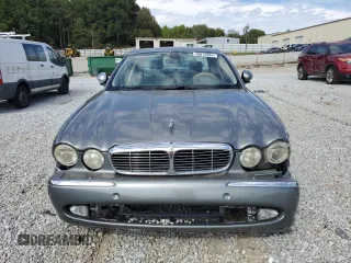 2006 Jaguar XJ with VIN SAJWA71B06SH03941, listed as a Copart auction lot 76013984 with 0 mi miles and Salvage Title. Bid and sale history available at carsss.com. Image 5.
