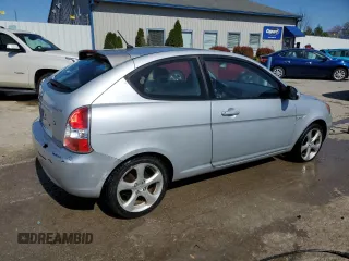 2007 Hyundai Accent SE z VIN KMHCN36C47U027122, wystawiony jako Copart lot #52224605 z przebiegiem 169 022 mil mil oraz Szkoda całkowita • Salvage title. Historia ofert i sprzedaży dostępna na DreamBid. Obrazek 3.