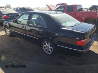 2001 Mercedes-Benz E-Class with VIN WDBJF65J01B325792, listed as a Copart auction lot 76328704 with 101,886 mi miles and Salvage Title. Bid and sale history available at carsss.com. Image 2.