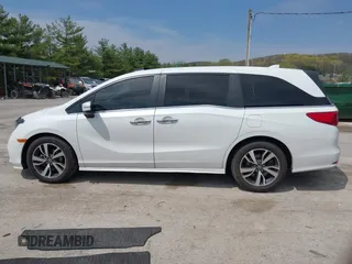 2021 Honda Odyssey Touring with VIN 5FNRL6H80MB010952, listed as a IAAI auction lot 42080412 with 90,594 mi miles and . Bid and sale history available at DreamBid. Image 14.