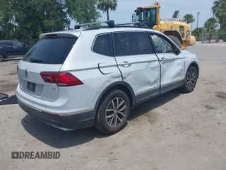 2018 Volkswagen Tiguan SEL with VIN 3VV3B7AX4JM201878, listed as a IAAI auction lot 42083809 with 115,956 mi miles and . Bid and sale history available at DreamBid. Image 4.