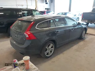 2015 Volvo V60 T5 Drive-E Premier with VIN YV140MEKXF1258073, listed as a IAAI auction lot 41428244 with 57,699 mi miles. Bid and sale history available at carsss.com. Image 4.