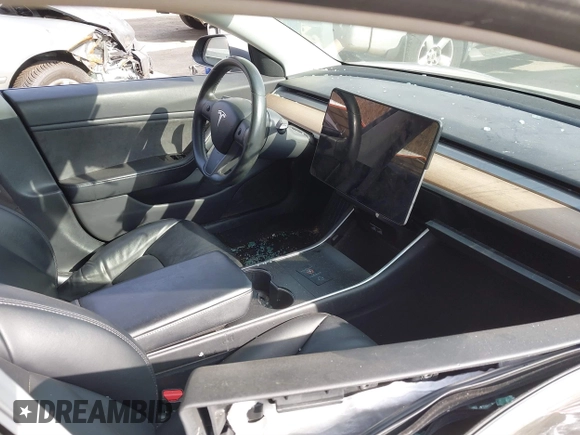 2018 Tesla Model 3 Long Range Battery with VIN 5YJ3E1EB5JF063077, listed as a IAAI auction lot 41773551 with 99,477 mi miles and . Bid and sale history available at DreamBid. Image 5.
