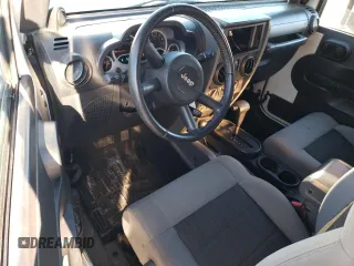2010 Jeep Wrangler Rubicon with VIN 1J4BA6D17AL132002, listed as a Copart auction lot 83869124 with 183,507 mi miles and Salvage title. Bid and sale history available at DreamBid. Image 8.