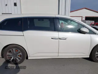 2014 Honda Odyssey Touring with VIN 5FNRL5H94EB001479, listed as a IAAI auction lot 41123678 with 147,269 mi miles and . Bid and sale history available at carsss.com. Image 13.