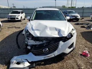 2016 Mazda CX-5 Sport с VIN JM3KE4BY1G0611368, выставлен на аукционе Copart как лот 56979385 с пробегом 106 397 миль миль и Списание • Salvage title. История ставок и продаж доступна на DreamBid. Изображение 5.