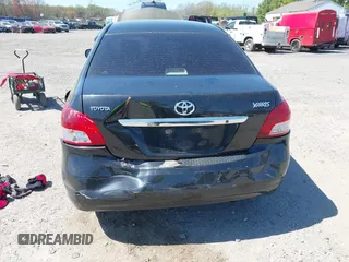 2009 Toyota Yaris with VIN JTDBT903294057773, listed as a IAAI auction lot 42071027 with 164,128 mi miles. Bid and sale history available at carsss.com. Image 6.