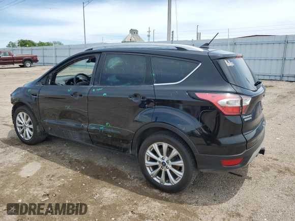 2018 Ford Escape Titanium with VIN 1FMCU9J95JUB31286, listed as a Copart auction lot 58721355 with 100,329 mi miles and Salvage title. Bid and sale history available at DreamBid. Image 2.