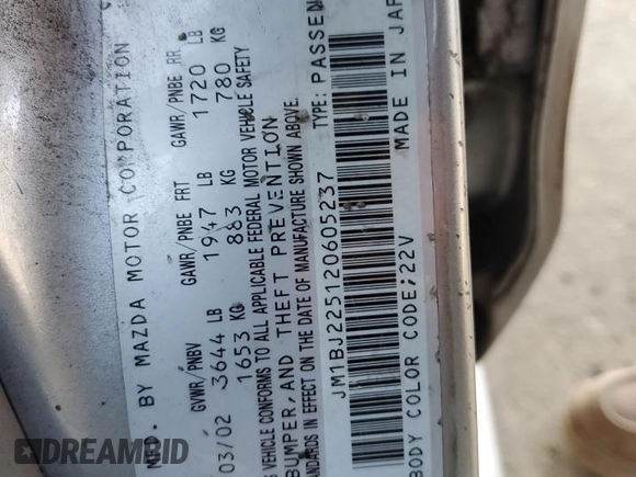 2002 Mazda Protege DX with VIN JM1BJ225120605237, listed as a Copart auction lot 49331225 with 184,556 mi miles and Salvage Title. Bid and sale history available at DreamBid. Image 14.