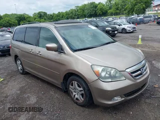 2006 Honda Odyssey Touring z VIN 5FNRL38876B092616, wystawiony jako IAAI lot #42503571 z przebiegiem 190 918 mil mil oraz . Historia ofert i sprzedaży dostępna na DreamBid. Obrazek 1.