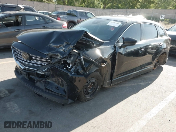 2018 Mazda CX-9 Sport with VIN JM3TCBBY6J0222750, listed as a IAAI auction lot 42294464 with 63,927 mi miles and . Bid and sale history available at DreamBid. Image 2.