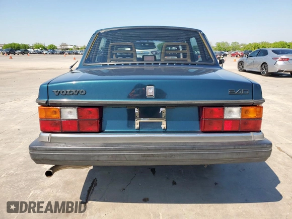 1992 Volvo 240 z VIN YV1AS8805N1467833, wystawiony jako Copart lot #51828515 z przebiegiem 178 826 mil mil oraz Szkoda całkowita • Salvage title. Historia ofert i sprzedaży dostępna na DreamBid. Obrazek 6.