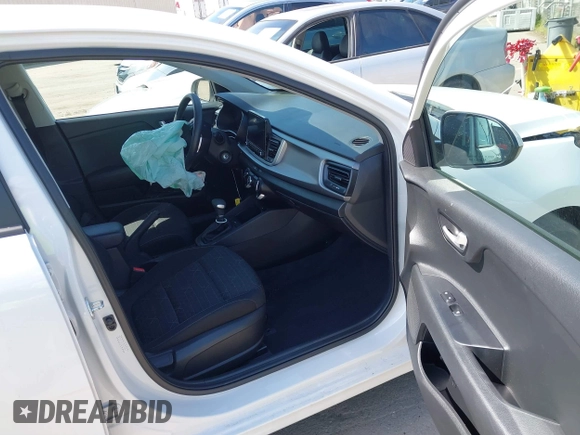 2023 Kia Rio S with VIN 3KPA25AD0PE629868, listed as a IAAI auction lot 41738952 with 25,642 mi miles and . Bid and sale history available at DreamBid. Image 5.