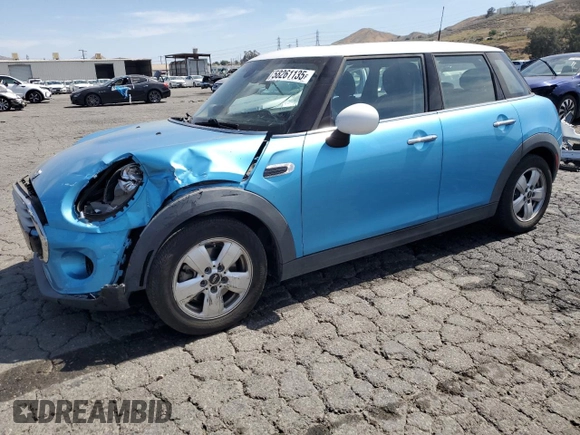 2015 MINI Hardtop 4 Door z VIN WMWXS5C5XFT827473, wystawiony jako Copart lot #58261135 z przebiegiem 75 439 mil mil oraz Szkoda całkowita • Salvage title. Historia ofert i sprzedaży dostępna na DreamBid. Obrazek 1.