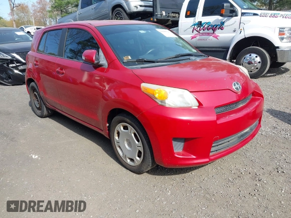 2010 Scion xD with VIN JTKKU4B43A1004049, listed as a IAAI auction lot 42088528 with 98,360 mi miles. Bid and sale history available at carsss.com. Image 1.