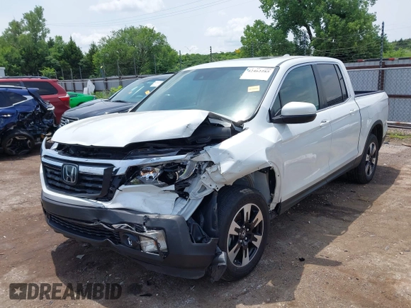 2020 Honda Ridgeline RTL with VIN 5FPYK3F51LB029859, listed as a IAAI auction lot 42462285 with 57,399 mi miles and . Bid and sale history available at DreamBid. Image 2.
