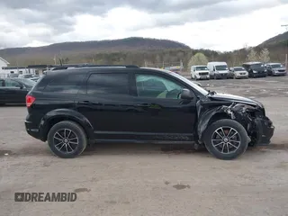 2018 Dodge Journey SE with VIN 3C4PDCAB1JT446005, listed as a IAAI auction lot 42001854 with 70,074 mi miles and . Bid and sale history available at DreamBid. Image 14.