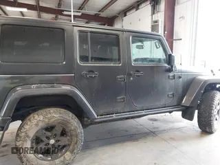 2017 Jeep Wrangler Unlimited Sahara with VIN 1C4BJWEG8HL638067, listed as a IAAI auction lot 41274352 with 57,339 mi miles. Bid and sale history available at carsss.com. Image 13.