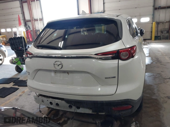 2020 Mazda CX-9 Touring z VIN JM3TCBCY8L0405360, wystawiony jako IAAI lot #41419428 z przebiegiem 69 917 mil mil oraz . Historia ofert i sprzedaży dostępna na DreamBid. Obrazek 16.