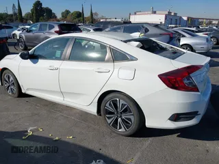 2017 Honda Civic EX-T with VIN 19XFC1E38HE002205, listed as a IAAI auction lot 40891678 with 10,398 mi miles and . Bid and sale history available at DreamBid. Image 3.