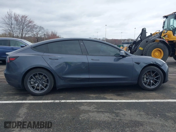 2022 Tesla Model 3 Long Range with VIN 5YJ3E1EB9NF206943, listed as a IAAI auction lot 41911040 with 69,920 mi miles and . Bid and sale history available at DreamBid. Image 13.