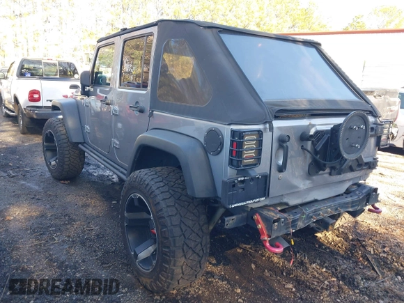 2015 Jeep Wrangler Unlimited Rubicon Hard Rock with VIN 1C4HJWFG1FL777222, listed as a IAAI auction lot 41843893 with 74,718 mi miles and . Bid and sale history available at DreamBid. Image 3.