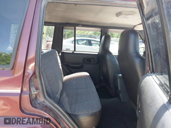 2001 Jeep Cherokee Sport with VIN 1J4FF48S51L516712, listed as a IAAI auction lot 42247399 with 323,576 mi miles and . Bid and sale history available at DreamBid. Image 8.