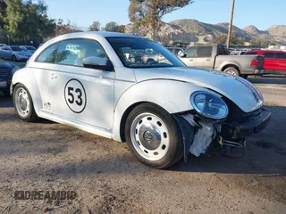 2017 Volkswagen Beetle 1.8T SE with VIN 3VWJ17AT9HM624498, listed as a IAAI auction lot 41662813 with 49,627 mi miles. Bid and sale history available at carsss.com. Image 1.