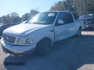 2002 Ford F-150 XLT with VIN 1FTRW08612KD90354, listed as a IAAI auction lot 41308528 with 207,261 mi miles. Bid and sale history available at carsss.com. Image 2.