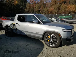 2022 Rivian R1T Launch Edition z VIN 7FCTGAAL6NN002704, wystawiony jako Copart lot #77913144 z przebiegiem 40 665 mil mil oraz Szkody całkowita. Historia ofert i sprzedaży dostępna na DreamBid. Obrazek 4.