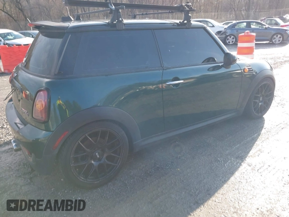 2007 MINI Hardtop S with VIN WMWMF73577TL89211, listed as a IAAI auction lot 41523679 with 136,705 mi miles and . Bid and sale history available at DreamBid. Image 4.