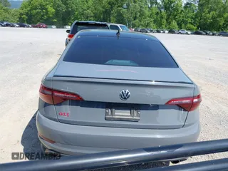 2021 Volkswagen Jetta GLI S z VIN 3VW6T7BU9MM052902, wystawiony jako IAAI lot #42286711 z przebiegiem 91 519 mil mil oraz . Historia ofert i sprzedaży dostępna na DreamBid. Obrazek 17.