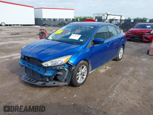 2018 Ford Focus SE z VIN 1FADP3F2XJL293337, wystawiony jako IAAI lot #42121294 z przebiegiem 71 241 mil mil oraz . Historia ofert i sprzedaży dostępna na DreamBid. Obrazek 2.