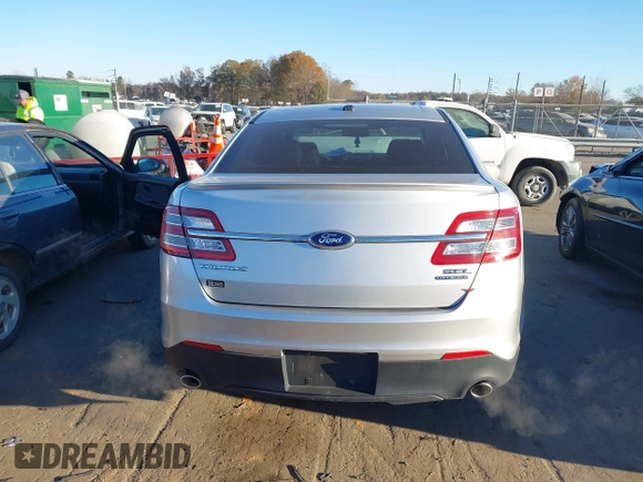 2014 Ford Taurus SEL z VIN 1FAHP2E87EG121069, wystawiony jako IAAI lot #41030422 z przebiegiem 138 043 mil mil oraz . Historia ofert i sprzedaży dostępna na DreamBid. Obrazek 16.