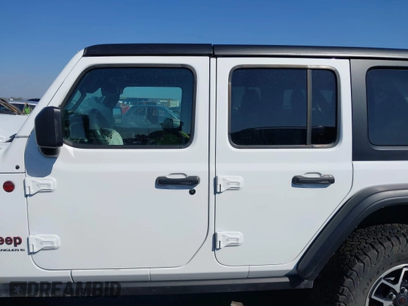 2024 Jeep Wrangler Rubicon with VIN 1C4PJXFG6RW291185, listed as a IAAI auction lot 41773050 with 12,400 mi miles and . Bid and sale history available at DreamBid. Image 14.